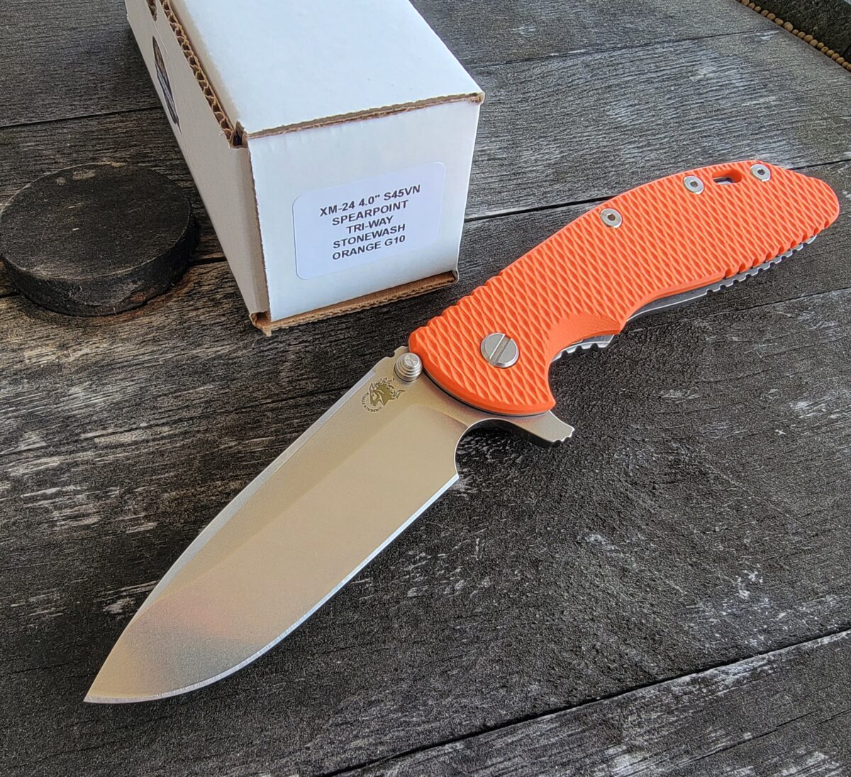 Rick Hinderer Orange G10 XM-24 4″ Spear Point Flipper Stonewash